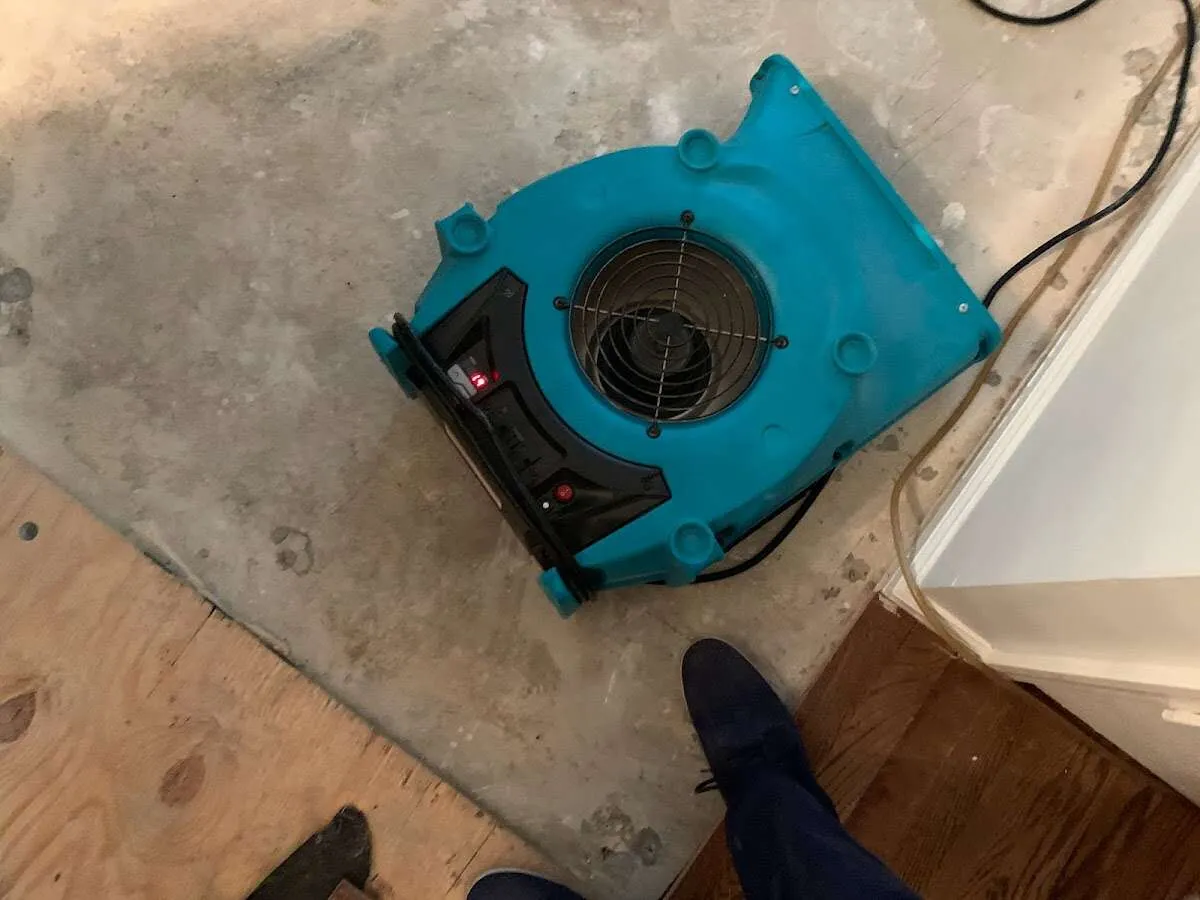 Air mover drying subfloor during Leak Detection & Repair in McKinleyville